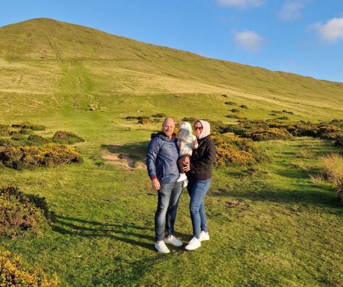 Family bundled up in coats in Wales