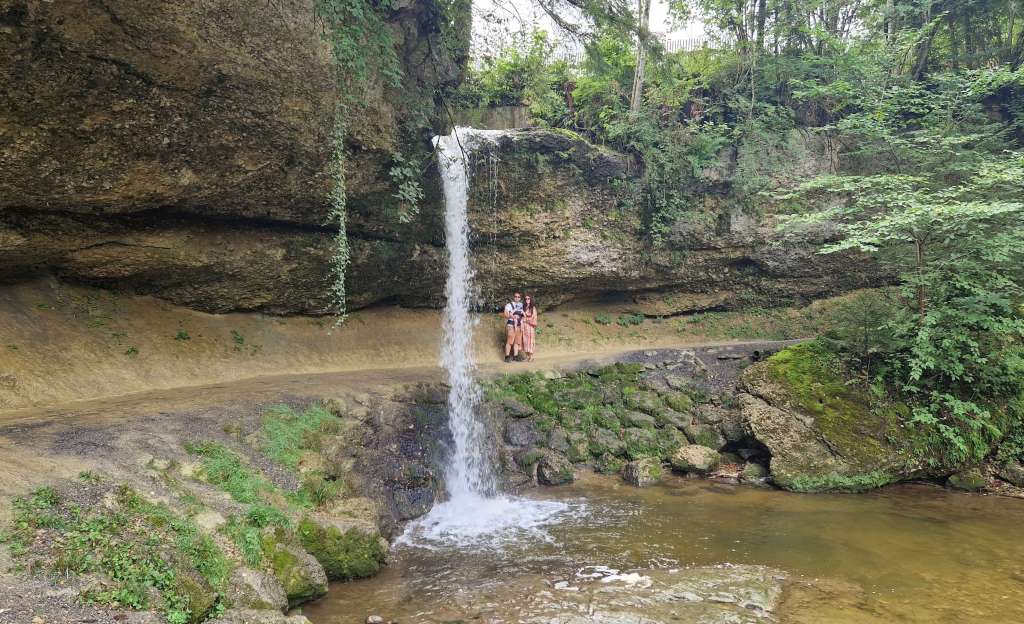 Family at Scheidegger Wasserfälle waterfalls in Germany during their first major travel adventure.