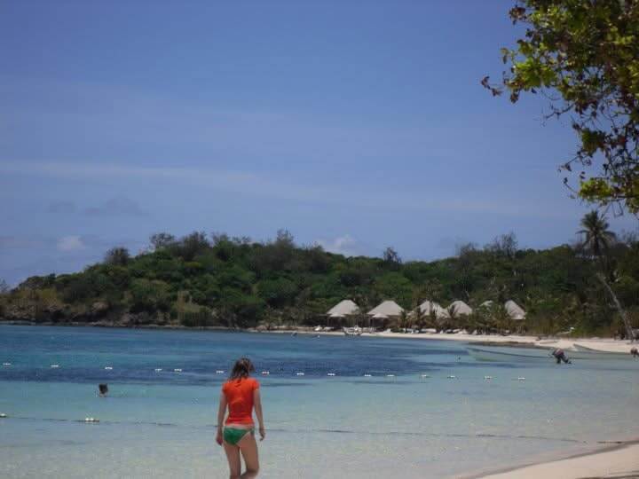 The author standing by the sea, gazing out at the water—capturing her deep connection with nature and love for freedom.