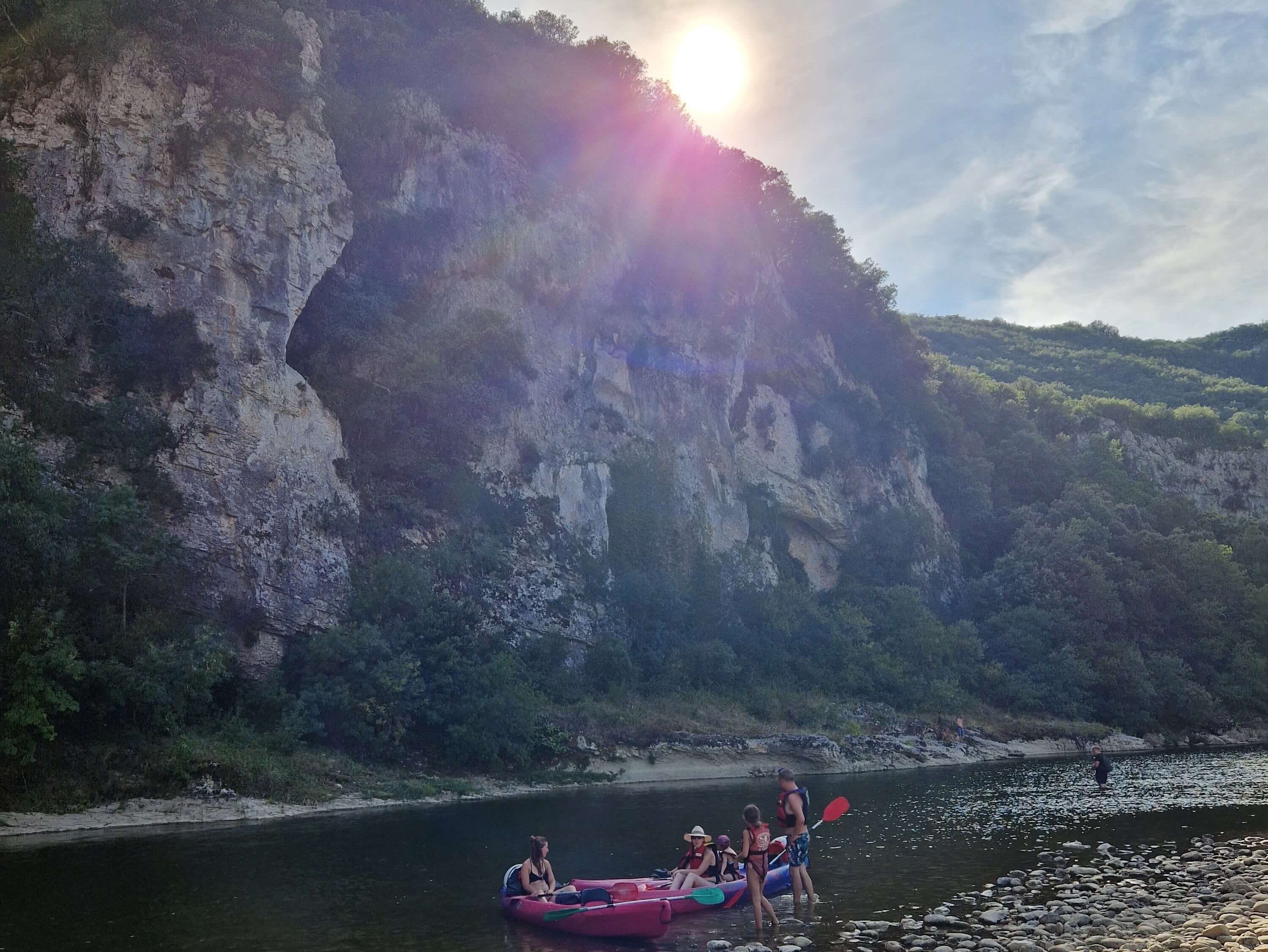 Calm river waters flowing through a rocky gorge in the Ardèche, France