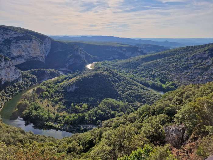 Winding river flowing through the Ardèche region of France