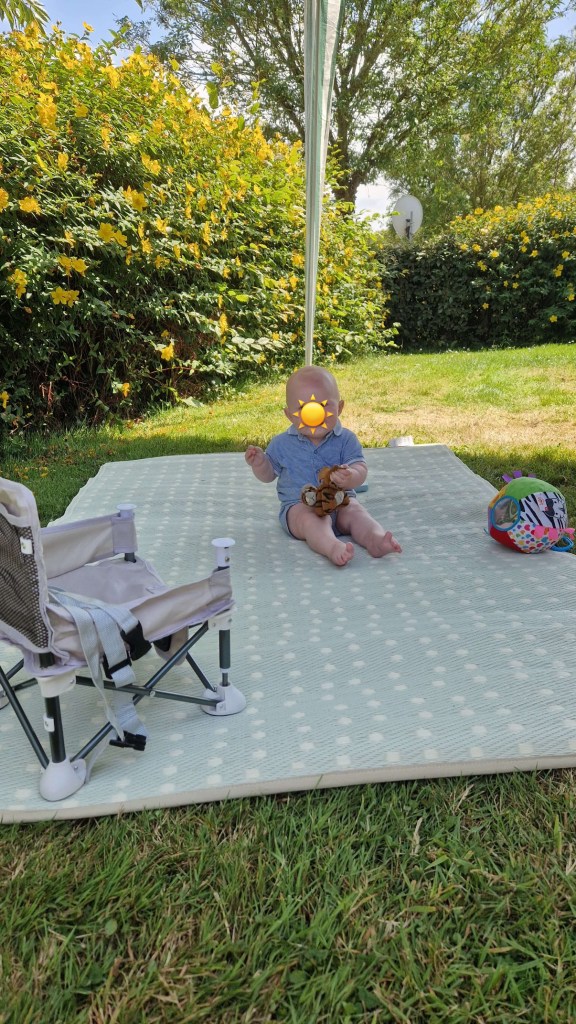 Tiny camper, big outdoors energy – Little Rick enjoying van life outside our setup