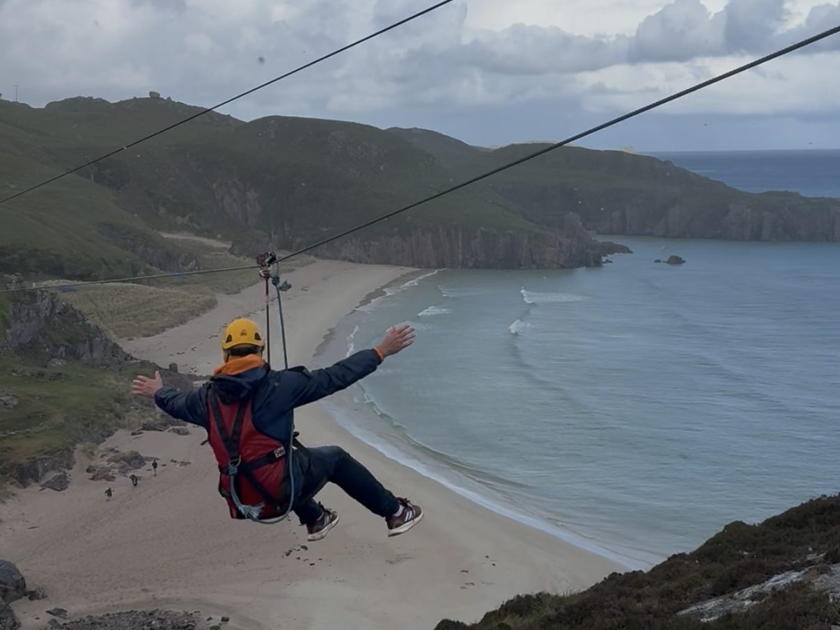 Mr Rick ziplining over Ceannabeinne Beach on the North Coast 500