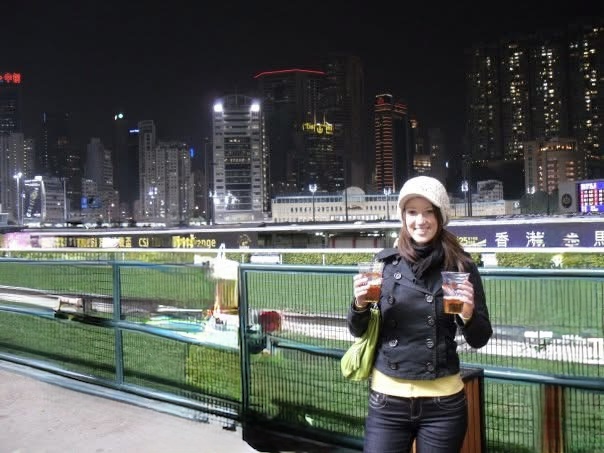 Young woman standing confidently in Hong Kong in 2010, embracing fearless travel