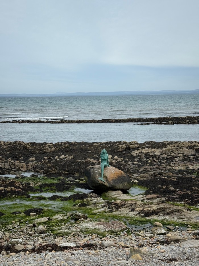 Mermaid of the North statue on a beach in Hilton, Scotland