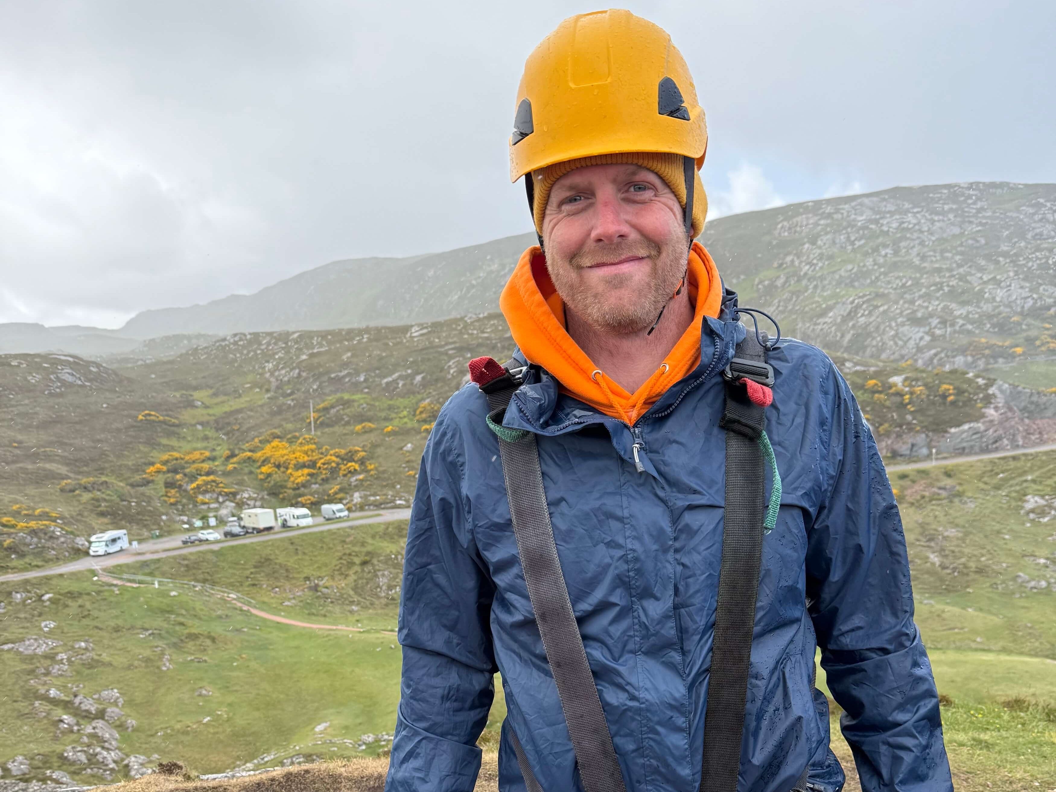 Man in harness ready to zipline over Ceannabeinne Beach on the North Coast 500