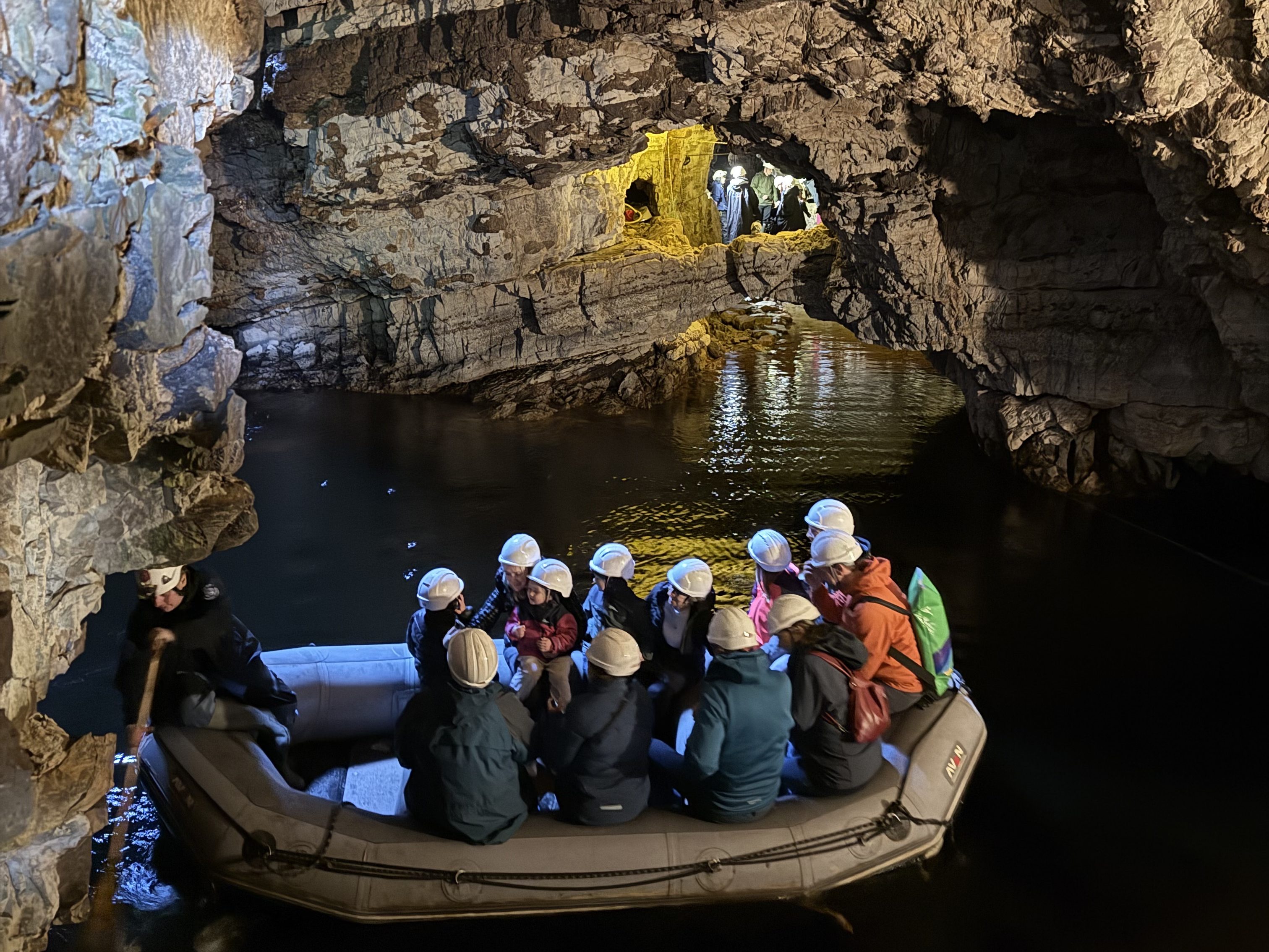 Small boat inside Smoo Cave on the NC500 route
