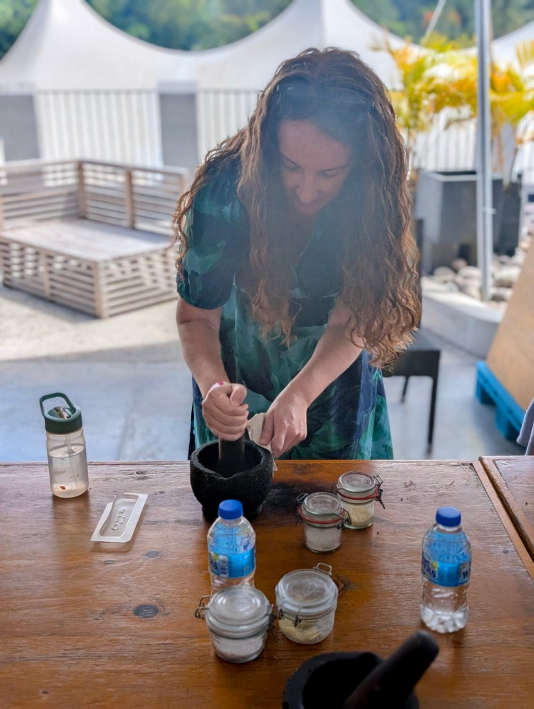 Grinding cacao beans by hand at Project Chocolat workshop, Rabot Estate, Saint Lucia