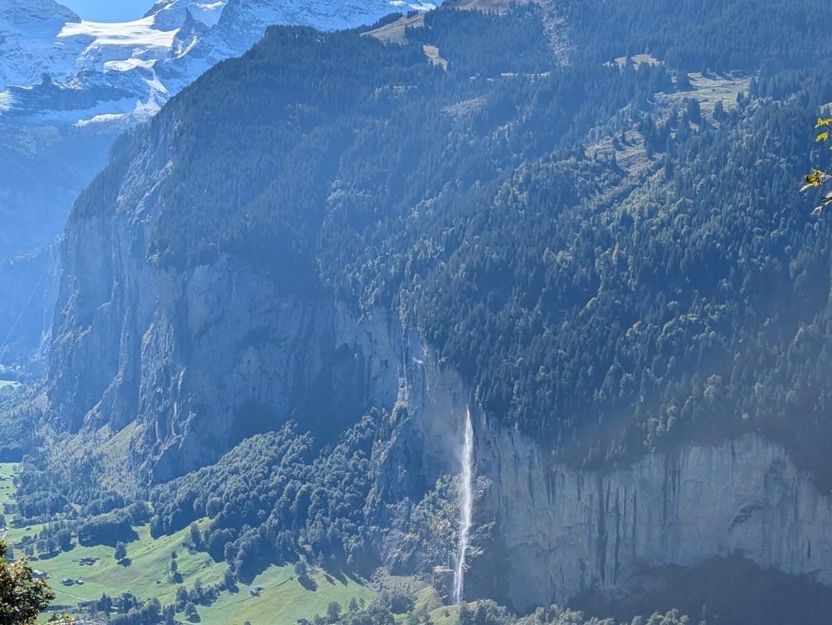 View of Staubbach Falls cascading down the mountain in Lauterbrunnen, Switzerland.