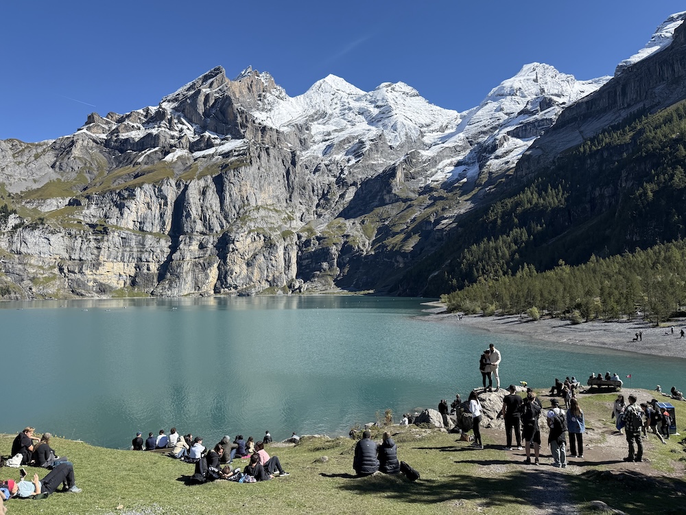 Stunning view of Oeschinensee Lake with turquoise water surrounded by mountains